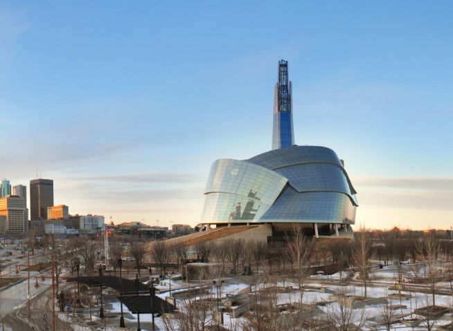 a building with a tall tower in the background
